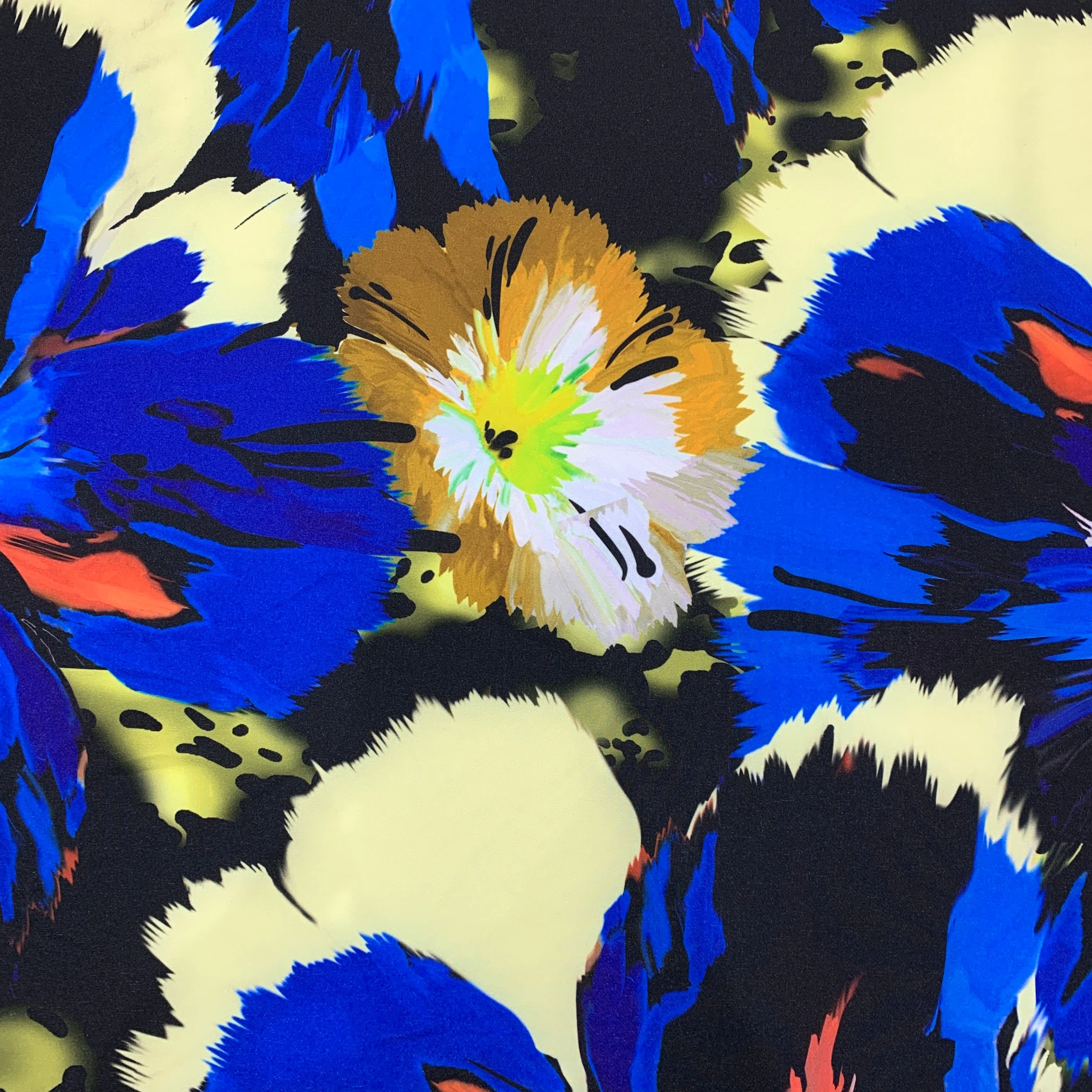 Blue Orange and Ivory Flowers on a Black Background Neoprene Printed Fabric