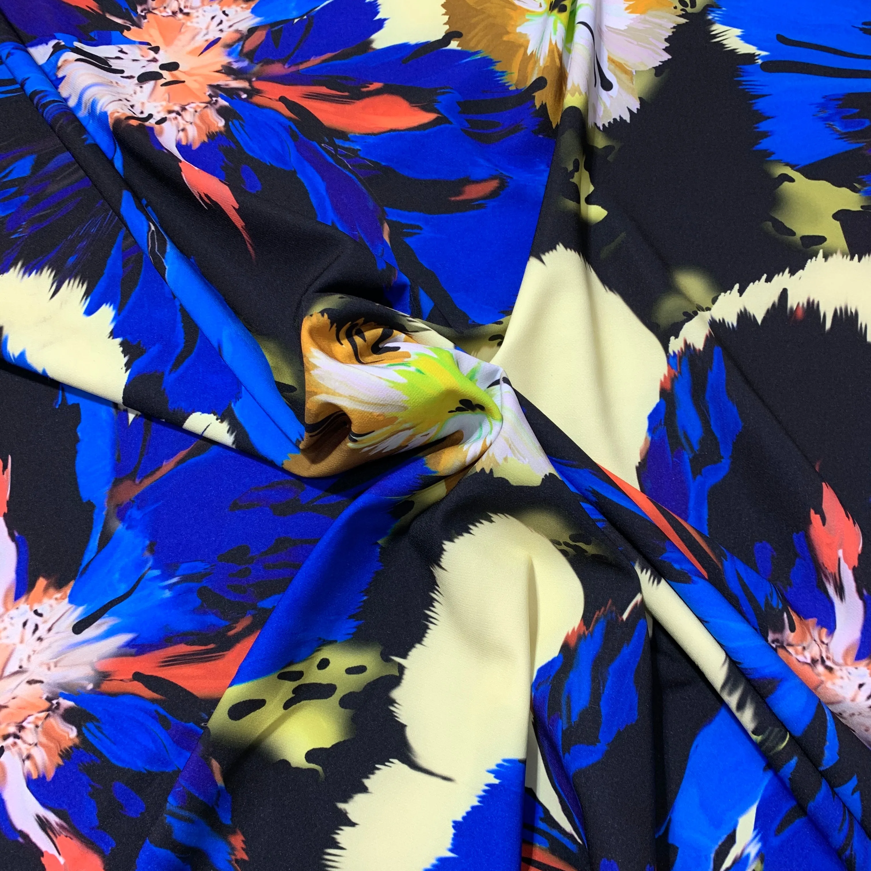 Blue Orange and Ivory Flowers on a Black Background Neoprene Printed Fabric